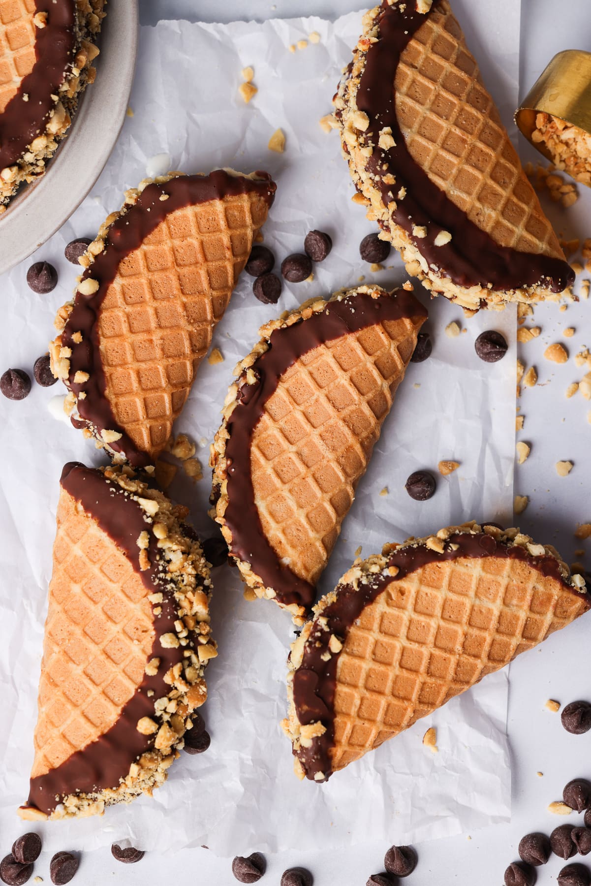 homemade ice cream tacos. they are covered in chocolate and peanuts.